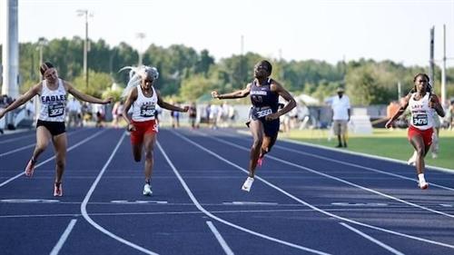 Rachael Uvieghara crossing the finish line for the state championship